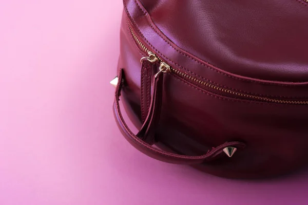 Red leather backpack on pink background — Stock Photo, Image