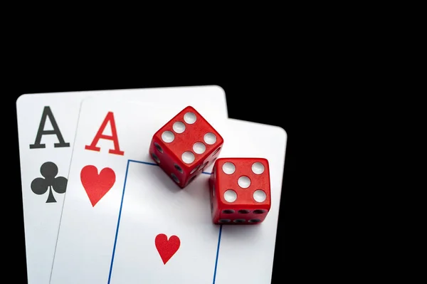 Close-up - Two aces, playing cards and red gaming dices on black table. — Stock Photo, Image