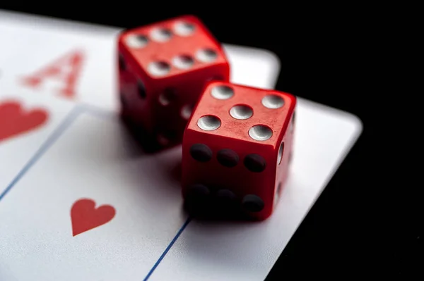 Close-up - Two aces, playing cards and red gaming dices on black table. — Stock Photo, Image