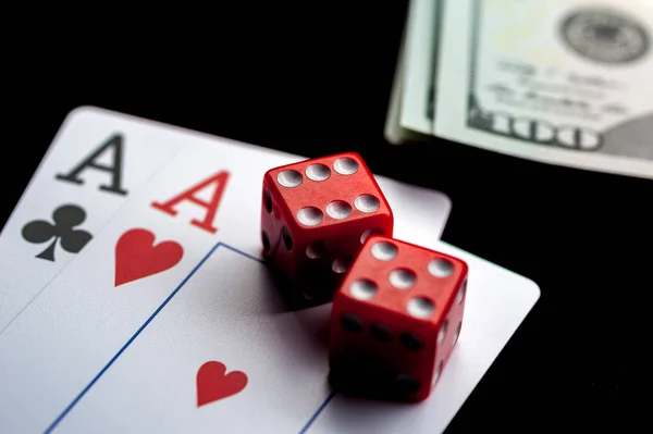 Close-up - Two aces, playing cards and red gaming dices on black table. — Stock Photo, Image