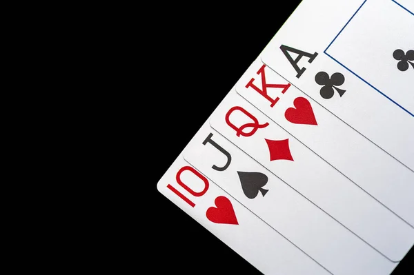 Playing cards on black table — Stock Photo, Image