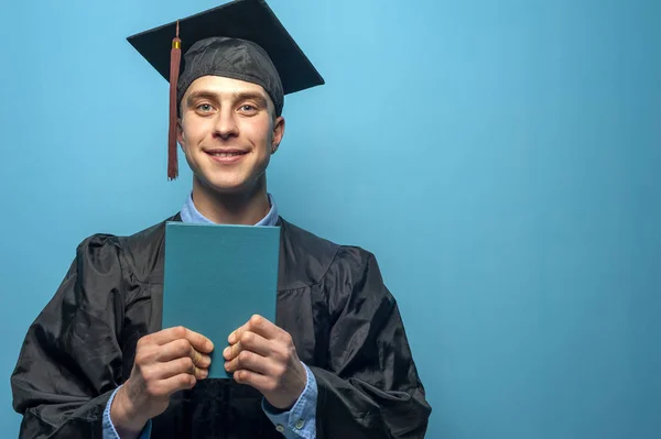 Graduate man with holding blue diploma — Stock Photo, Image