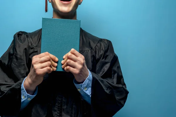 Graduate man with holding blue diploma — Stock Photo, Image