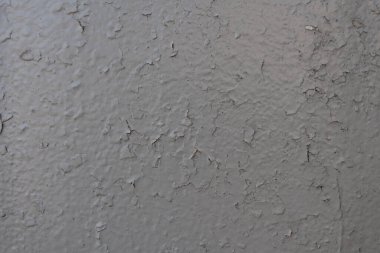 Yakın plan - evin eski cephesinde gri-kahverengi taş duvar