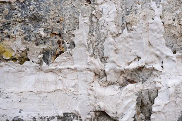 Primo piano - muro di pietra grigia nella vecchia facciata della casa — Foto Stock