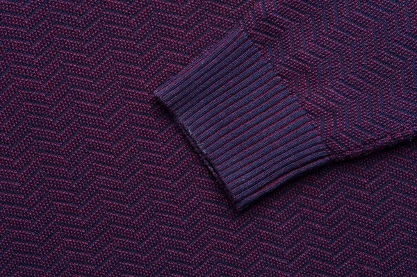 Close-up fragment of warm knitted purple hirts. Concept of warm everyday things. clothing store concept. Advertising space. Place for text