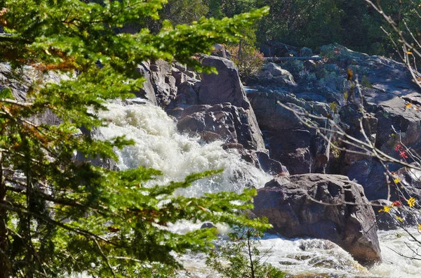 Cascading water over rocks in Superior Lake Provincial park, Canada