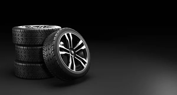 Quatre roues de voiture sur fond noir. Illustration de rendu 3D. — Photo
