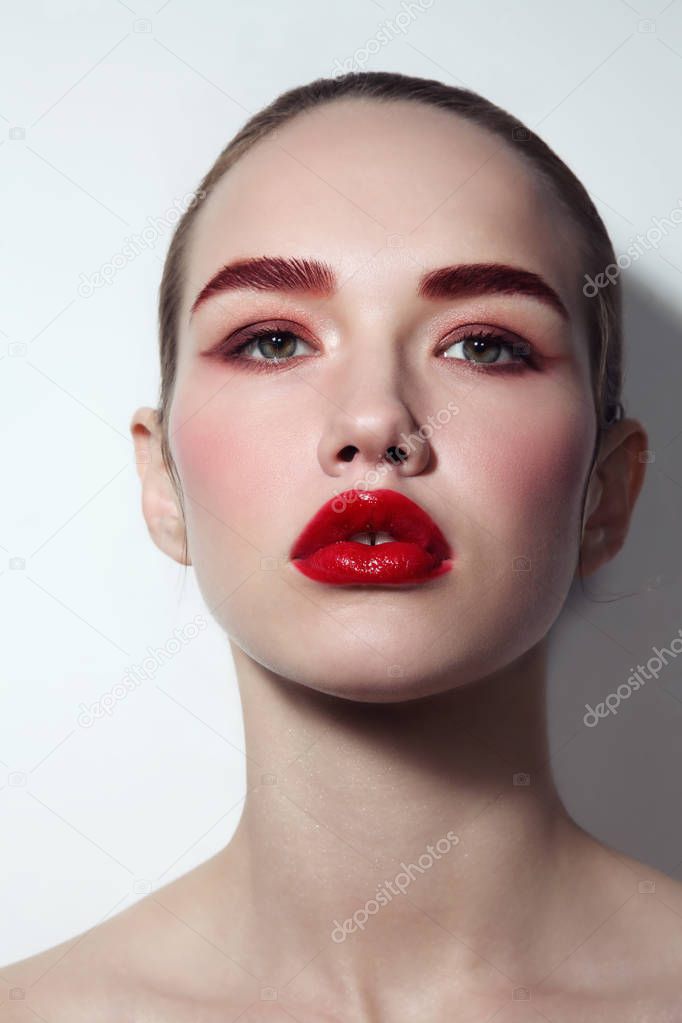 Young beautiful glamorous woman with red lipstick