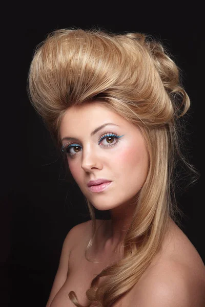 Young beautiful woman with vintage style prom hairdo and fancy m Stock Picture