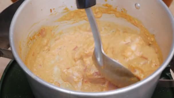 Step by step cooking tom yam soup. Chicken fillet added to boiling coconut milk with chili paste. Thai cuisine. Closeup. 4k — Stock Footage Step by step cooking tom yam soup. Chicken fillet added to boiling coconut milk with chili paste. Thai cuisine. Closeup. 4k Stock Video