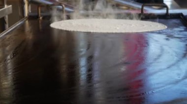 Masala dosa is a South Indian food. Chef make masala Dosa or dosai with potato stuffed inside. South Indian vegetarian, traditional and popular breakfast, with butter. 4k