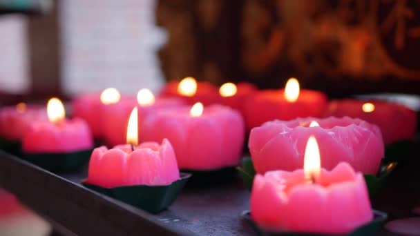 Flame from burning pink candles in Chinese Ancestral Temple. 4k — Stock Video