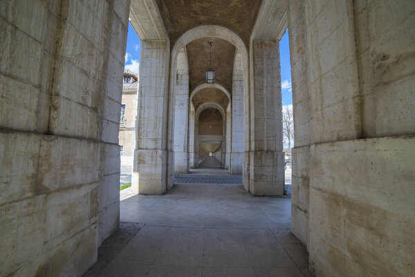 Passage Old arcs, architecture. A sight of the palace of Aranjuez (a museum nowadays), monument of the 18th century, royal residence Spain.