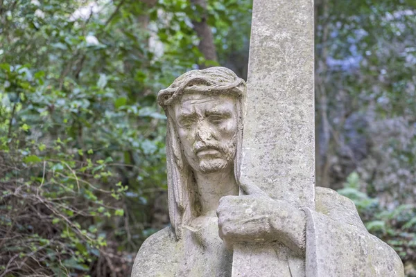 sculpture of jesus on the cross made in stone in the monastery of Montserrat in Barcelona, Spain