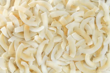 Kavrulmuş fırında kızarmış doğal ince dilimlenmiş Hindistan cevizi cips arka plan