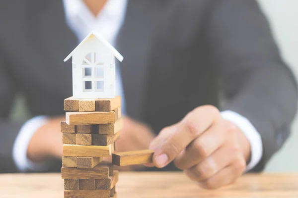 Businessman Hand Holding Wood Block Model White House Investment Risk — Stock Photo, Image