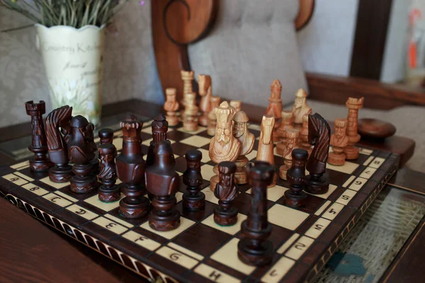 Chess board with chess pieces on light background — Stock Photo, Image