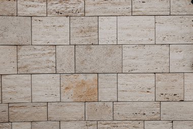 Taş bir duvarın dokusu. Eski kale taşından duvar dokusu. Arka plan ya da doku olarak taş duvar. Bir taş duvarın parçası, arkaplan veya doku için