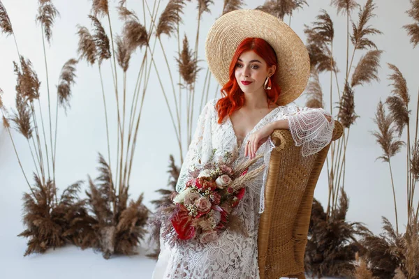 Wedding content - close-up Portrait of a young beautiful redhair girl in a studio sitting on a white background with a decorations. Copy space — Stock Photo, Image