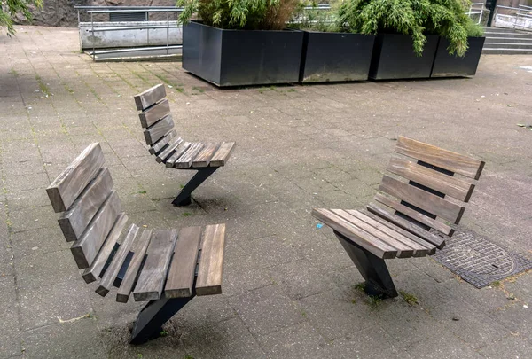 Practical and comfortable street furniture in Rotterdam, Netherlands. All these chairs can rotate on their axis and could be turned to any direction.