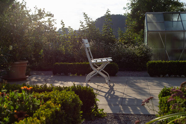 cottage garden plastic shed on a summer evening in south german bavaria countryside