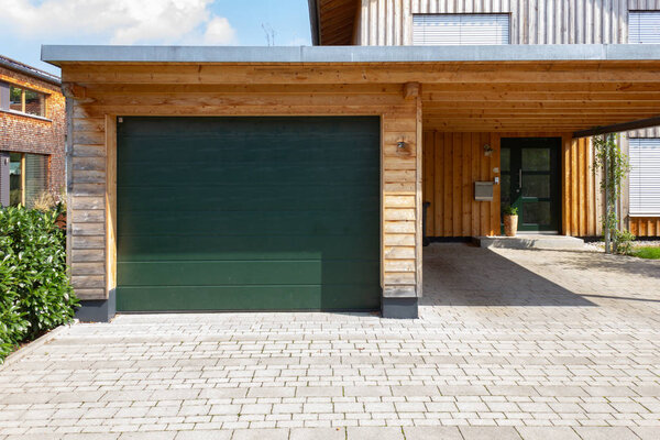 Wooden and modern carport in southern german village area