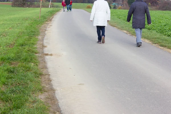 bikeway on a autumn november afternoon with cycles or walking people in south germany countryside near city of munich and stuttgart