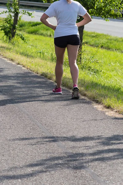 young lady on outdoor exercise in summer at rural countryside in south germany