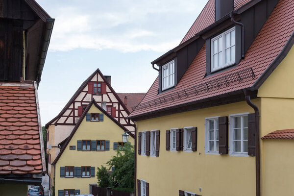 In a historical city of bavaria in south germany at summertime old wooden timber frame buildings with windows, doors and deecorations are a romantical place to have holiday of even relaxing time
