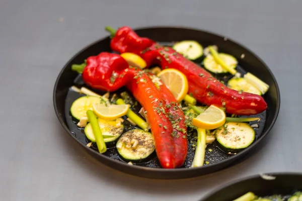 grilled paprika with a touch of garlic and lemon preparation with knife cutting board and plate for oven