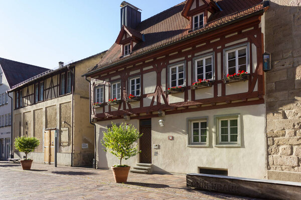 Facades architecture and outdoor details like pots and plants of a historical city in september fall season in south germany near city of stuttgart
