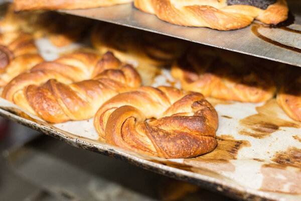 baking pastries and bread in an oven with gold brown delicious colors at a bakery in south germany