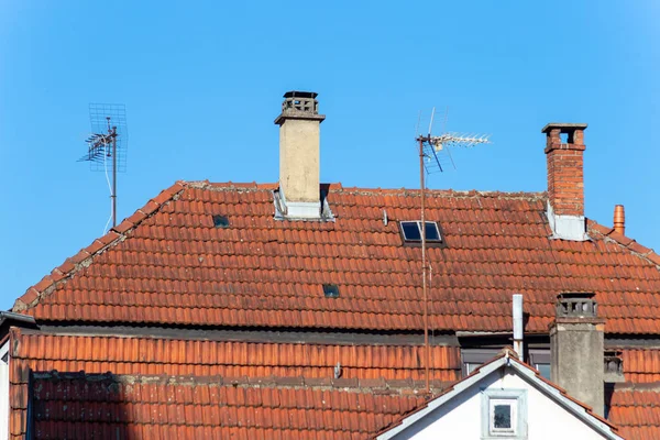 city facades rooftops antenna chimney in springtime evening in south germany