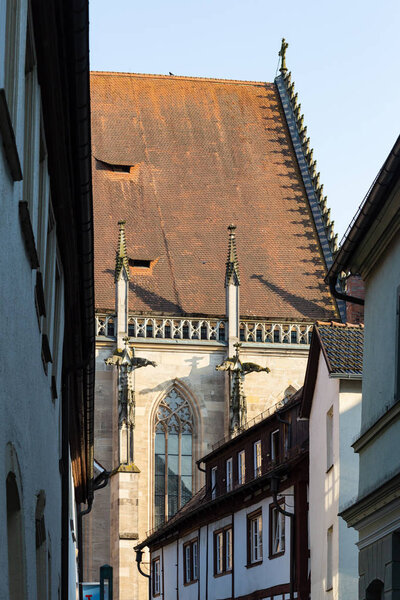 Facades and rooftops of historical church on a sunny springtime happy holiday
