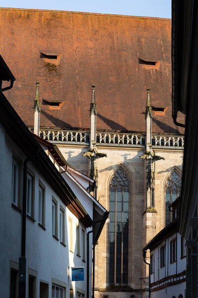 Facades and rooftops of historical church on a sunny springtime happy holiday