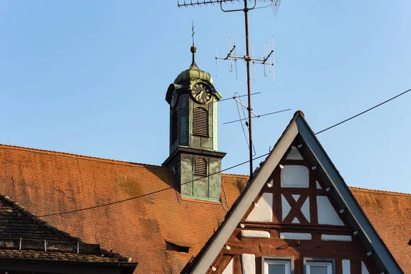 antenna and rooftops of historical buildings on a sunny springtime happy holiday in south germany