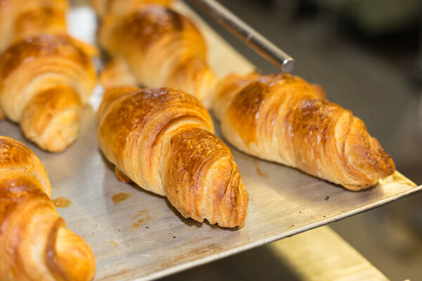 baking pastries and bread in an oven with gold brown delicious colors at a bakery in south germany