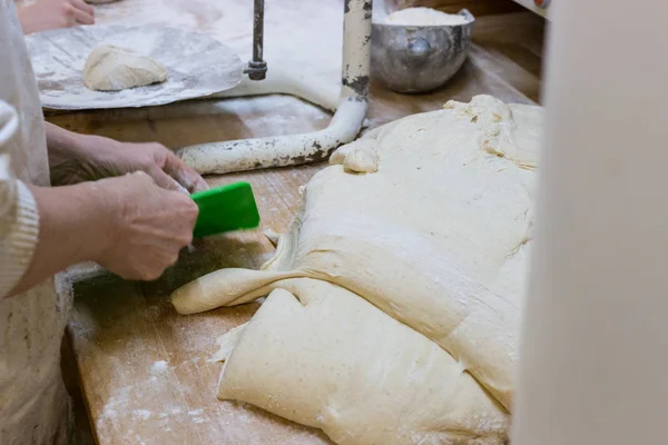 preparation of baked goods in a bakery with tools for preparing pastries