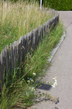 garden fence of modern house architecture in rural countryside at springtime in south germany near city stuttgart