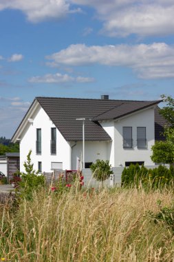 garden fence of modern house architecture in rural countryside at springtime in south germany near city stuttgart