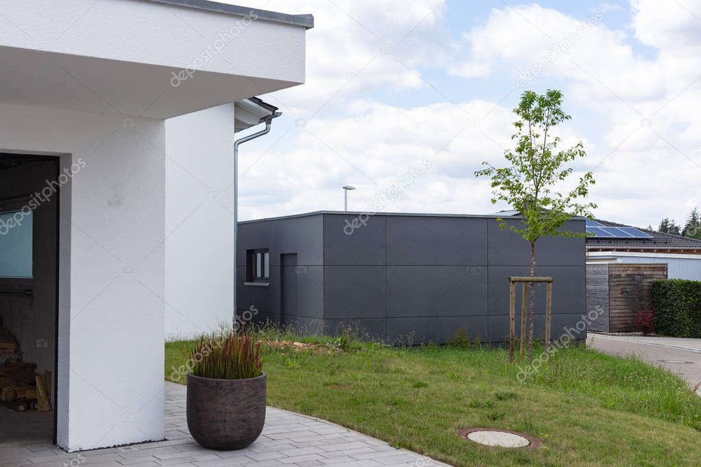 modern black garage in suburban street in south germany countryside near city stuttgart