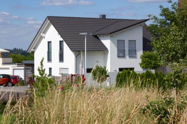 garden fence of modern house architecture in rural countryside at springtime in south germany near city stuttgart