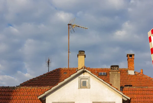 rooftops with antenna of old buildings at sunny afternoon in south germany