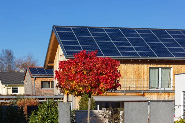 rooftop of buildings with solar panels in germany bavaria colorful autumn sunhine afternoon