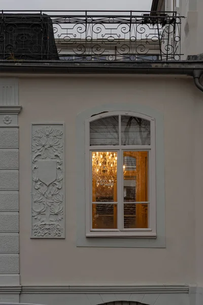 cafe window facade with lustre at evening in historical city of south germany