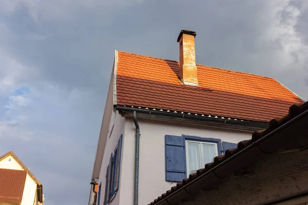 rooftop with chimney of historical building in south germany at october autumn month