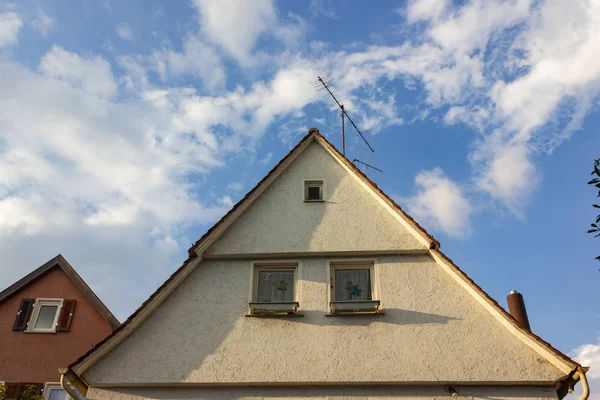 rooftop with antenna on historical buildings at october afternoon