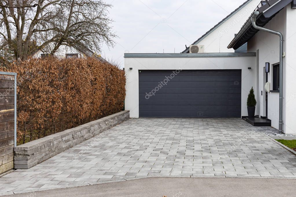 modern house carports in south germany countryside village on february afternoon