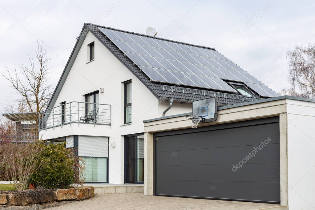 modern house carports in south germany countryside village on february afternoon
